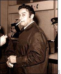 Lenny Bruce, smoking at airport